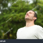 stock-photo-relaxed-adult-man-breathing-fresh-air-in-a-forest-with-green-trees-in-the-background-1517688029 stock-photo-relaxed-adult-man-breathing-fresh-air-in-a-forest-with-green-trees-in-the-background-1517688029